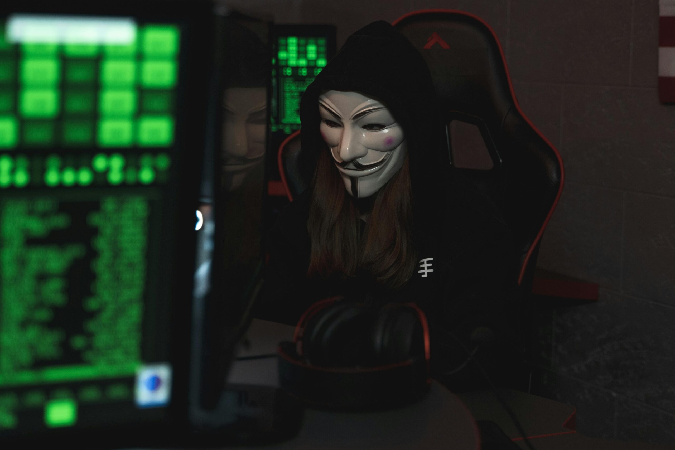 Photo by Tima Miroshnichenko: https://www.pexels.com/photo/person-with-mask-sitting-while-using-a-computer-5380610/